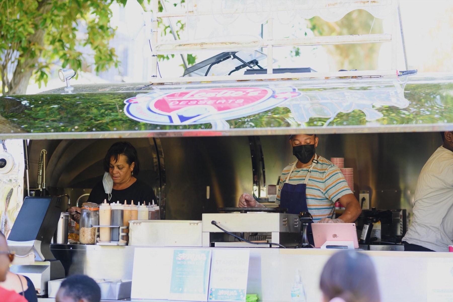 Leslie's Desserts staff serving a customer